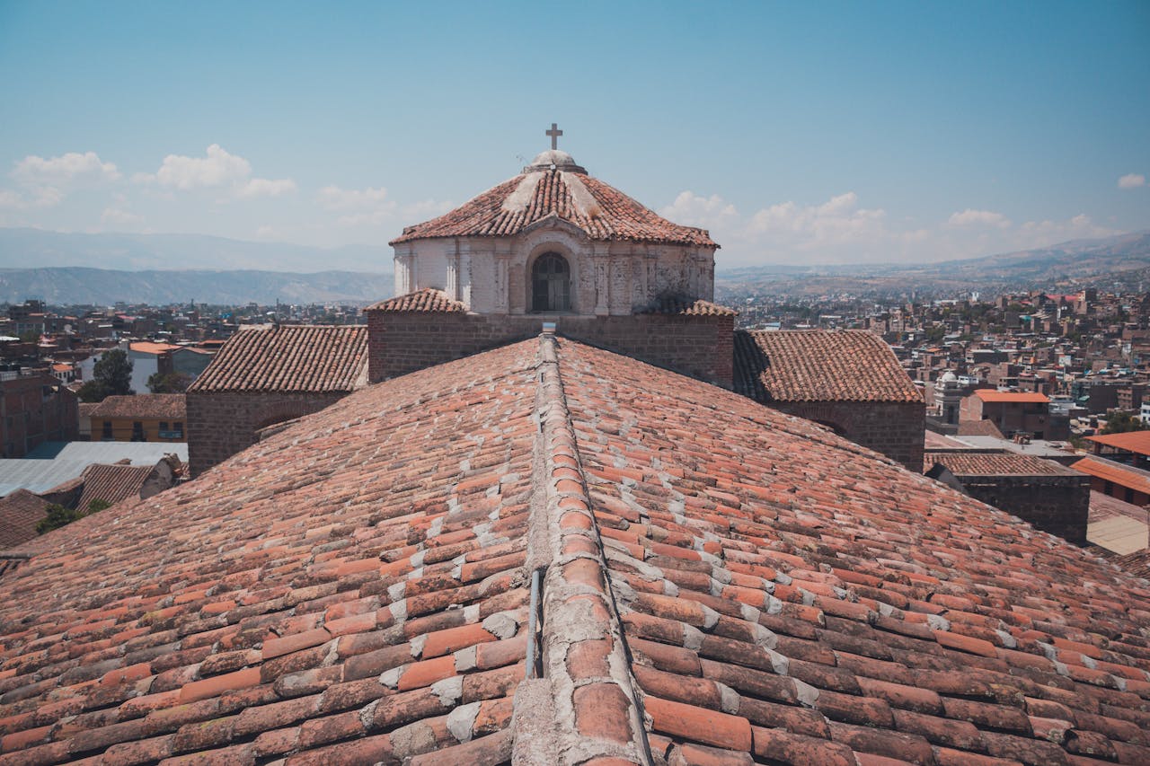 The roof of a church with a cross on it